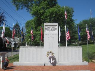 Veterans memorial with American flags in the background